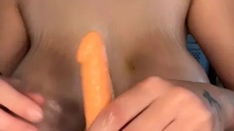 Blonde with big tits and nipple piercings fucks dildo between her brea