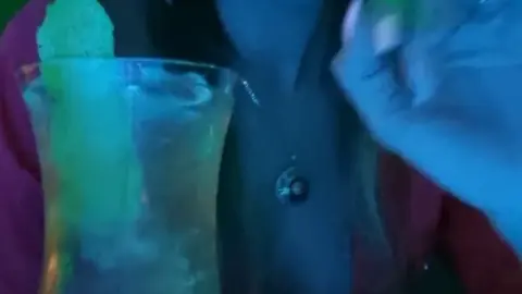 Brunette with septum piercing flashes tits at neon bar