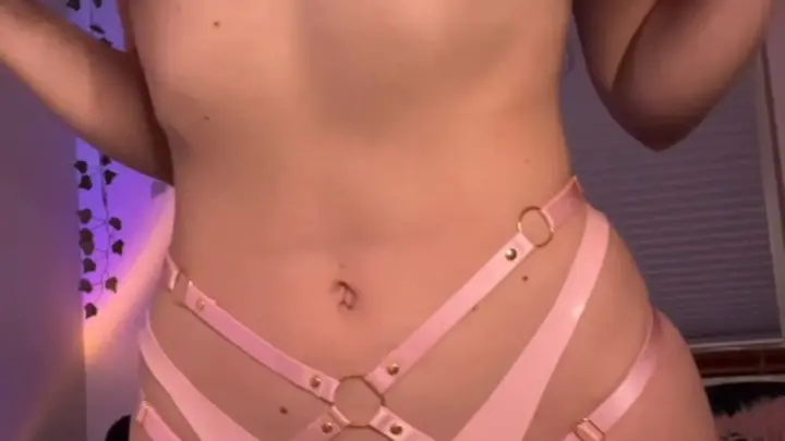 Brown-haired curvy girl strips to lingerie, shows ass and tits on bed