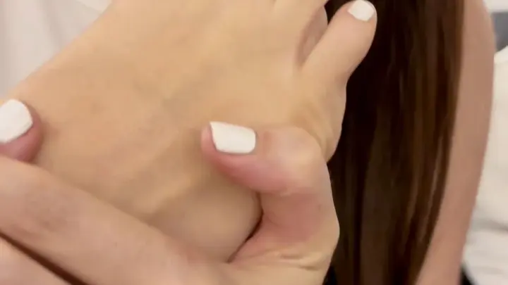 Brunette in white toenails licks her foot, adjusts gray underwear