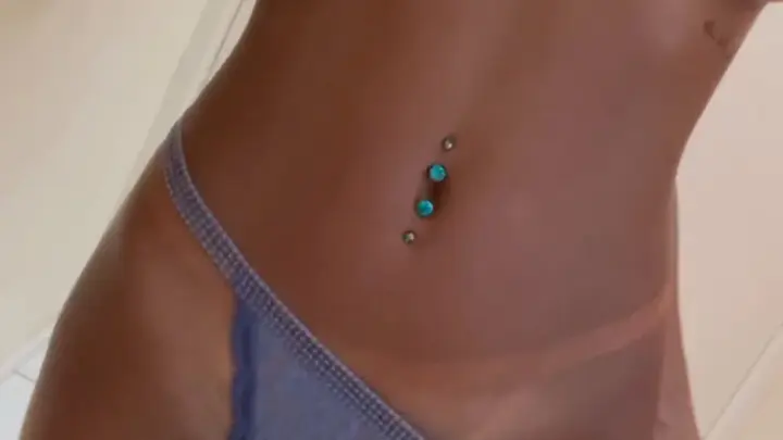 Black girl in light blue underwear poses in bathroom close-ups
