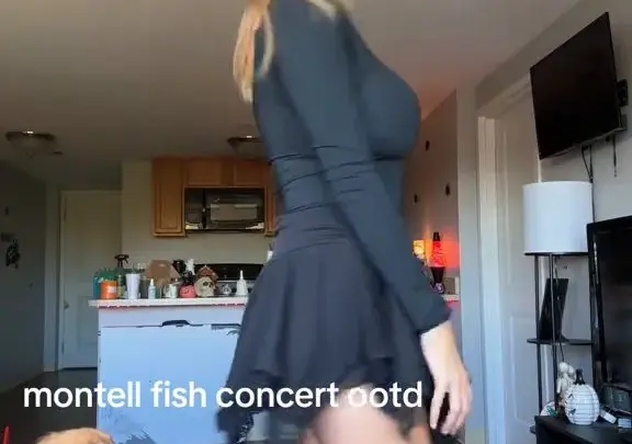 Blonde in living room with dog, casual home video vibes