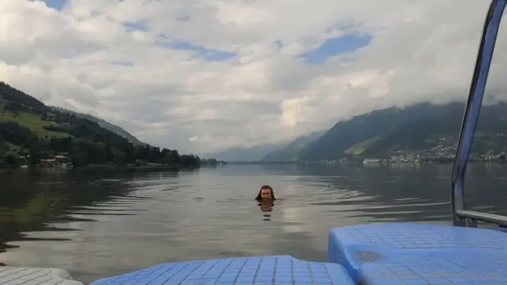 Naked brunette swimming alone in lake POV shots