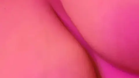 Curvy blonde with nipple piercings gives blowjob in pink-purple light