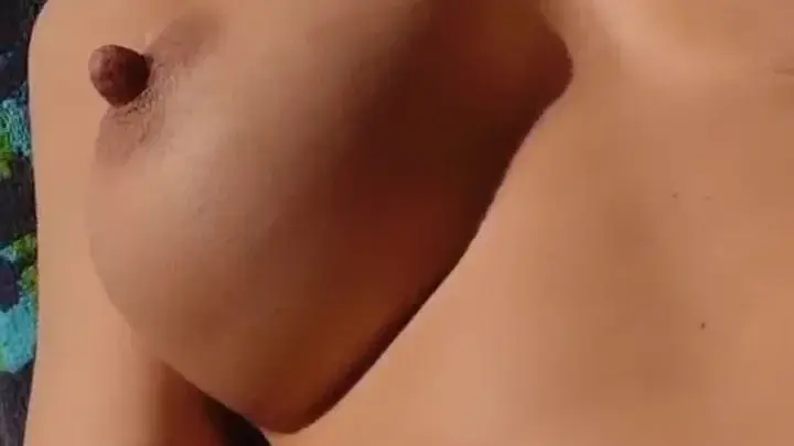 Asian Teen with Large Breasts Shows Off Topless Indoors