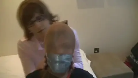 TranniesInTrouble nina jay bedtied pantyhose hooded by sandra lrg